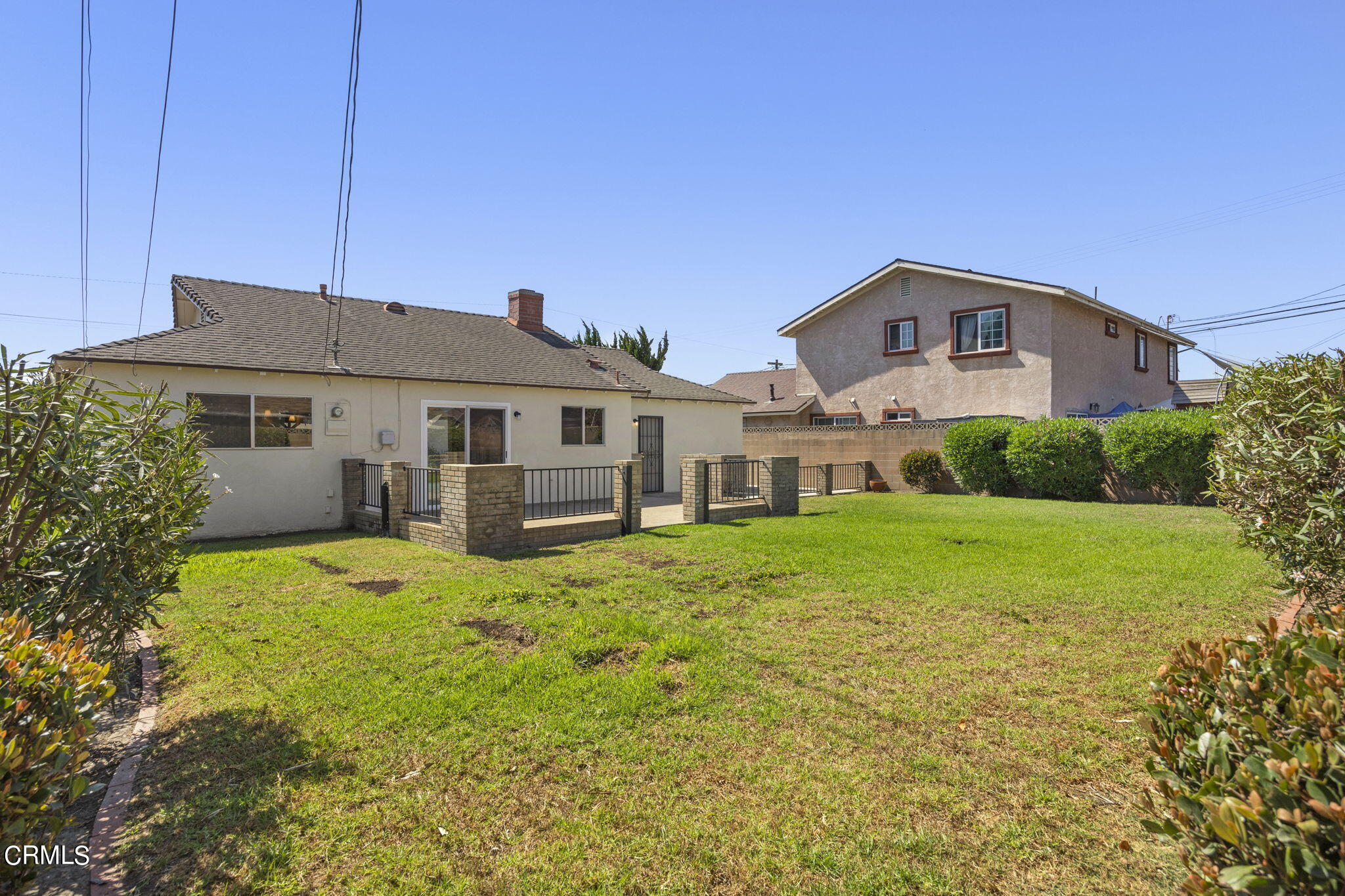 1225 Azalea Street Oxnard, CA 93036 - Photo 32 of 41 a front view of a house with a yard