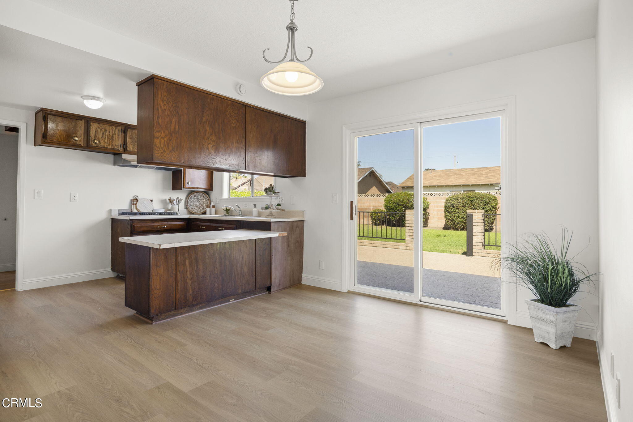 1225 Azalea Street Oxnard, CA 93036 - Photo 8 of 41 a kitchen with stainless steel appliances granite countertop a stove a sink and a refrigerator