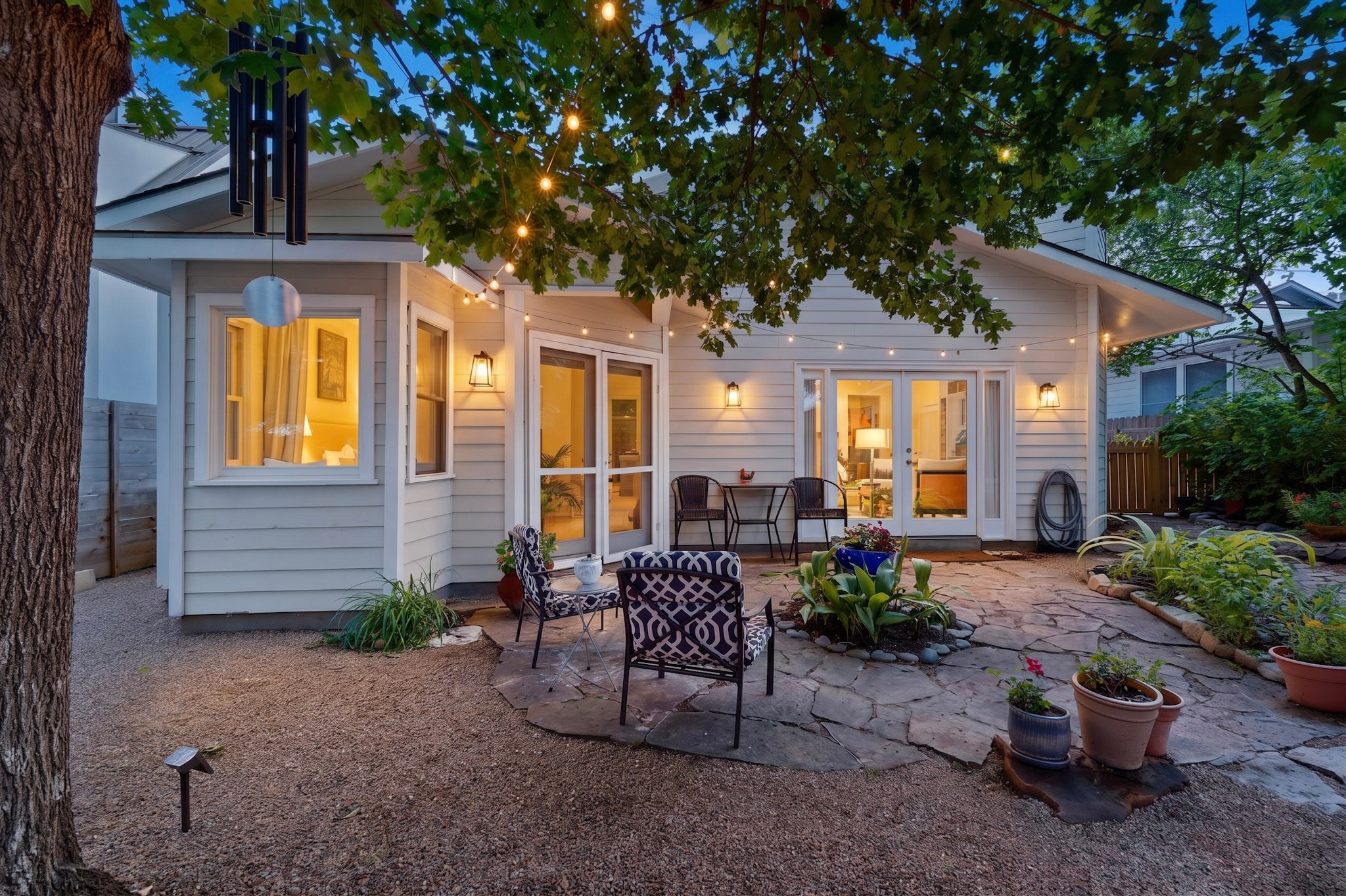 1906 Collier Street Austin, TX 78704 - Photo 32 of 40 An inviting backyard patio offers a perfect spot for twilight relaxation and intimate gatherings.