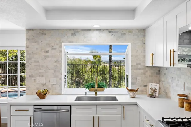 a kitchen with a sink and a window