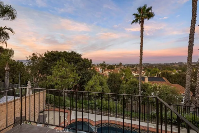 a view of a palm tree from a balcony