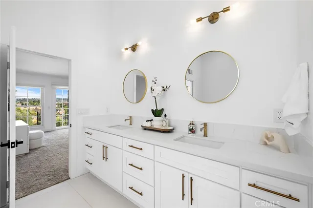 a bathroom with a double vanity sink and a mirror