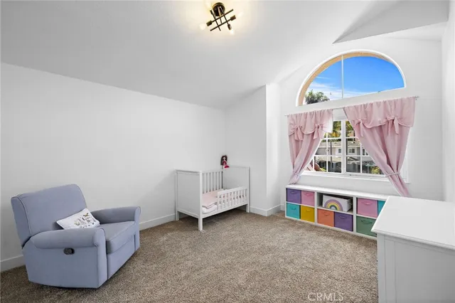 a living room with furniture and white walls