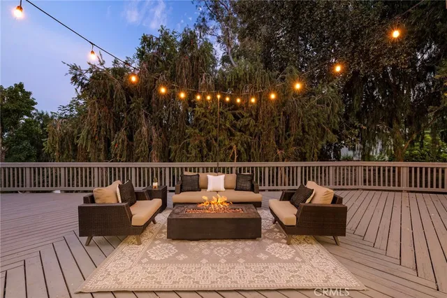 a balcony with furniture and wooden floor