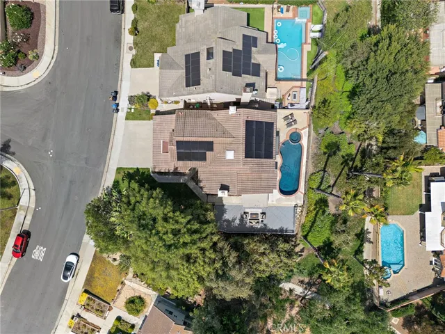 an aerial view of a house with a garden