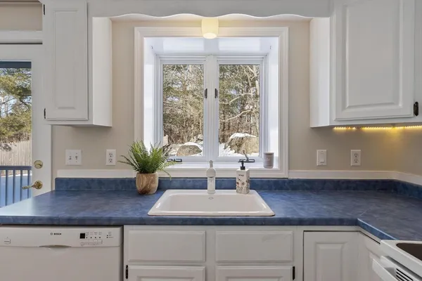 a kitchen with a sink and a window