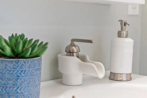 a bedroom with a large bed couch and window