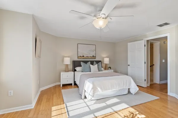 a bed room with a bed and a chandelier