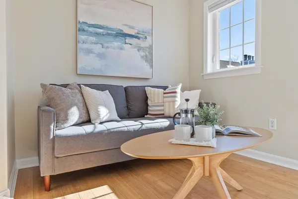 a view of livingroom with furniture and floor to ceiling window