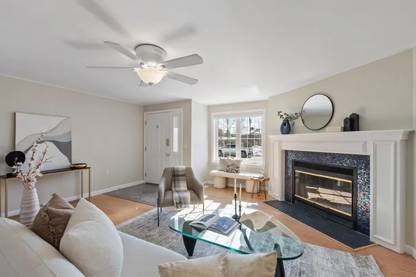 a living room with furniture and a fireplace