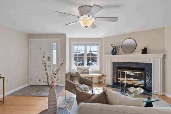 a living room with furniture and a fireplace