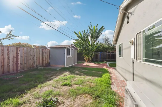 a view of a backyard with a garden