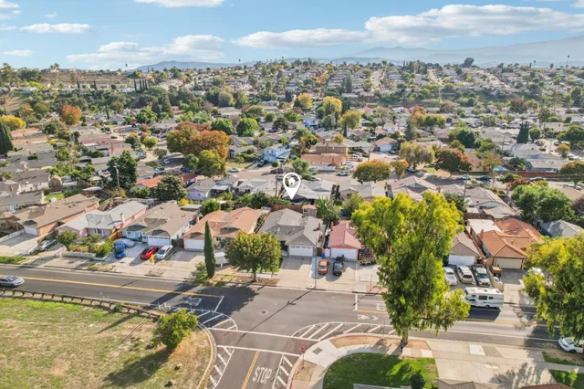 an aerial view of residential houses with outdoor space