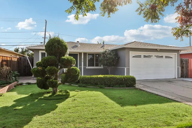 a front view of a house with garden