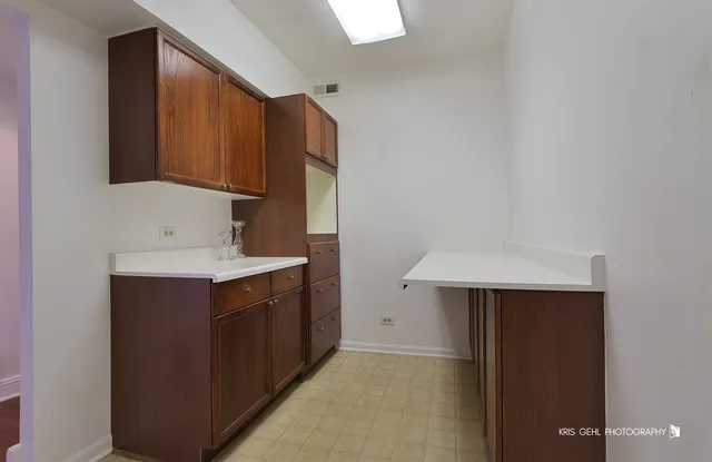 a bathroom with a sink and mirror