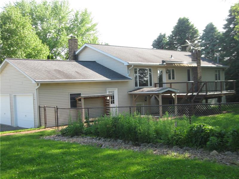 628 Unionville Road Butler, PA 16001 - Photo 4 of 21 Back view shows attached two car garage, trex deck with roll up awning and partially fenced back yard.