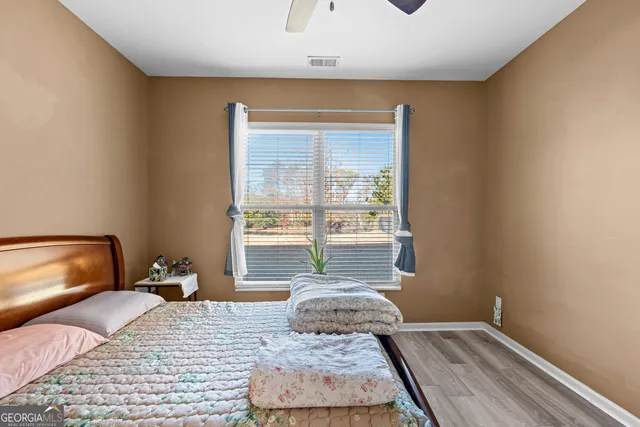 a bathroom with a sink a toilet and shower curtain