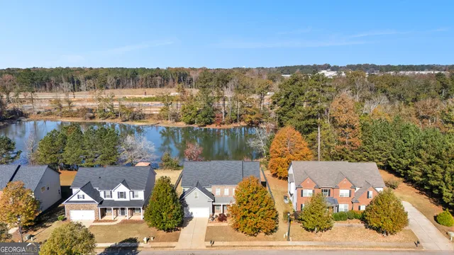 an aerial view of a house with a lake view