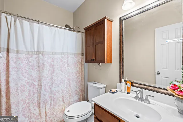 en view of entryway and hall with wooden floor