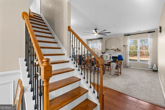 a living room with furniture window and wooden floor