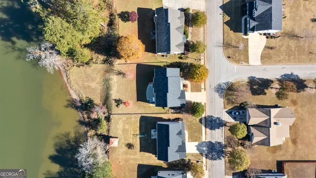 aerial view of a house with large trees