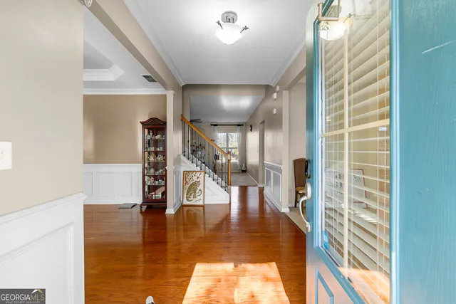 a view of entryway with wooden floor