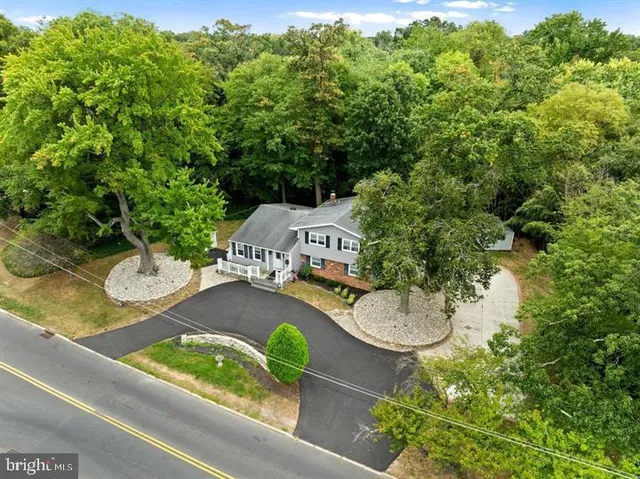a view of a swimming pool with a yard