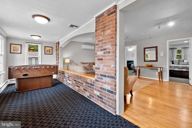 a view of living room filled with furniture and window