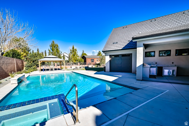 1283 North Gallen Road Santa Clara, UT 84765 - Photo 54 of 103 Integrated pool / hot tub with a gazebo, exterior kitchen, a fenced backyard, and a patio area