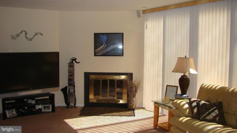 11603 Windbluff Court Reston, VA 20191 - Photo 5 of 22 a living room with furniture and a flat screen tv