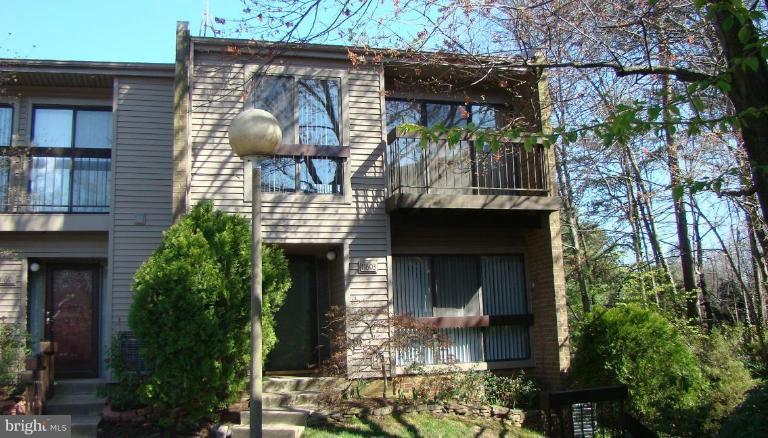 11603 Windbluff Court Reston, VA 20191 - Photo 7 of 22 a front view of a house with garden