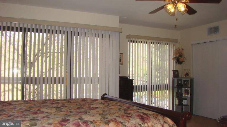 11603 Windbluff Court Reston, VA 20191 - Photo 10 of 22 a view of a balcony with a bed and a chandelier