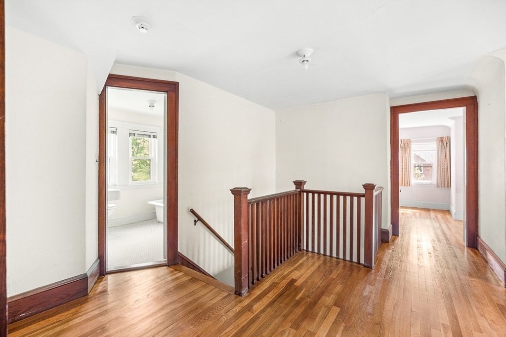 30 Rangeley Road Winchester, MA 01890 - Photo 29 of 42 a view of a hallway with wooden floor and a bathroom
