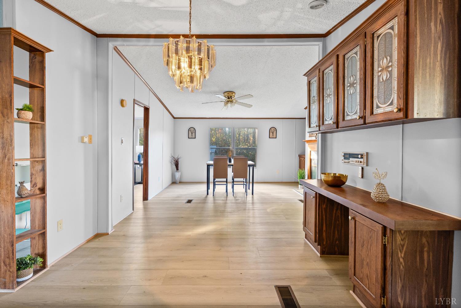 2213 Rabat Road Nathalie, VA 24577 - Photo 17 of 40 a open kitchen with stainless steel appliances granite countertop a refrigerator a sink dishwasher a dining table and chairs with wooden floor