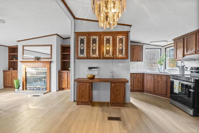 a kitchen with stainless steel appliances granite countertop a stove and cabinets