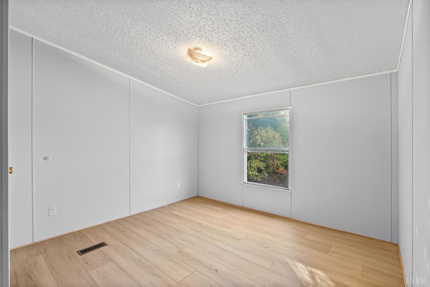 2213 Rabat Road Nathalie, VA 24577 - Photo 23 of 40 a view of an empty room with a window