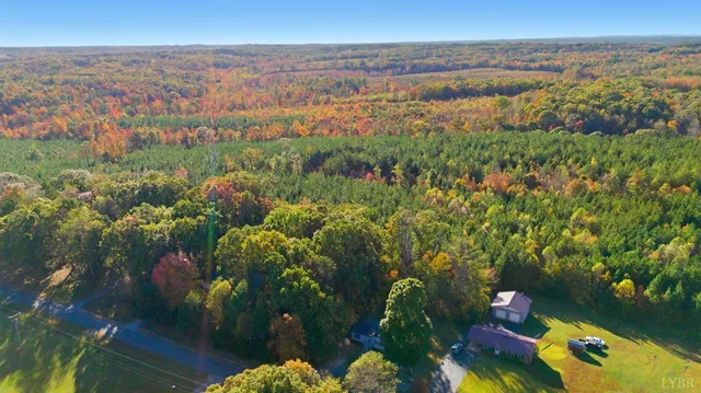 an aerial view of a city and lake view