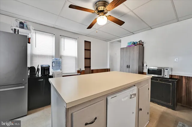 a kitchen with a refrigerator a sink and dishwasher