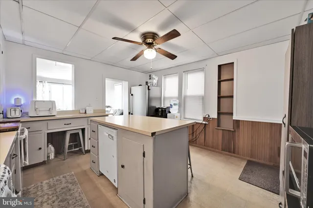 a kitchen with cabinets a sink and appliances
