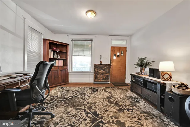 a view of a workspace with furniture and bedroom