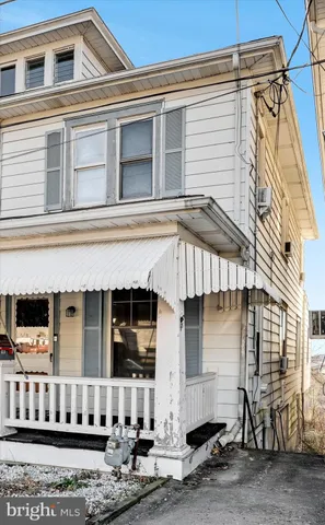 a front view of a house with garage