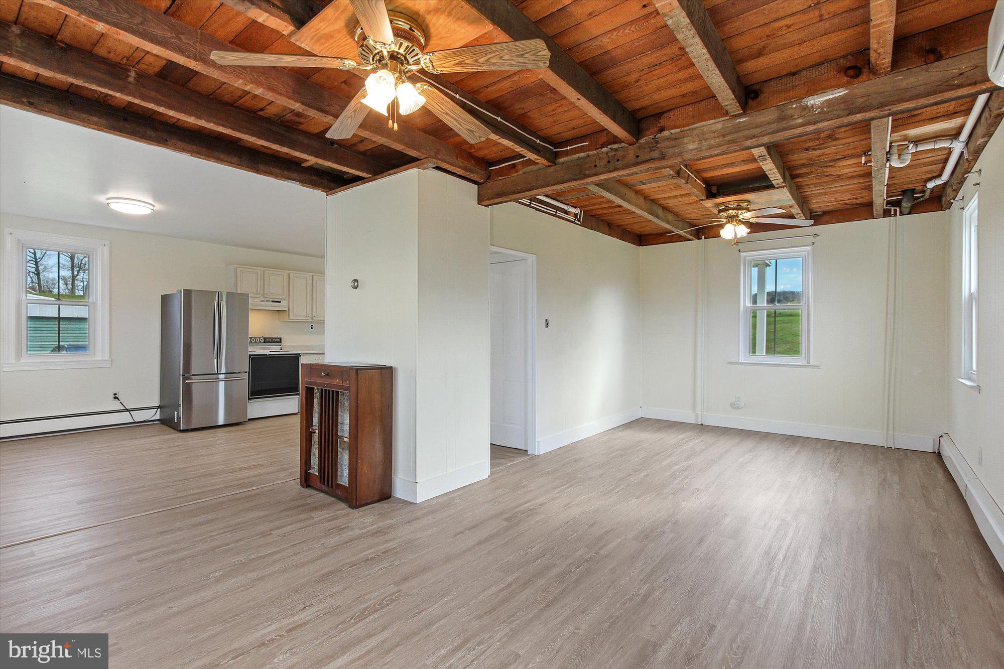 725 Poff Road York, PA 17406 - Photo 20 of 35 living room/dining area combo w/exposed ceiling