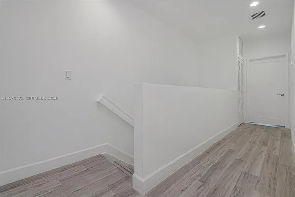 a view of small space with wooden floor