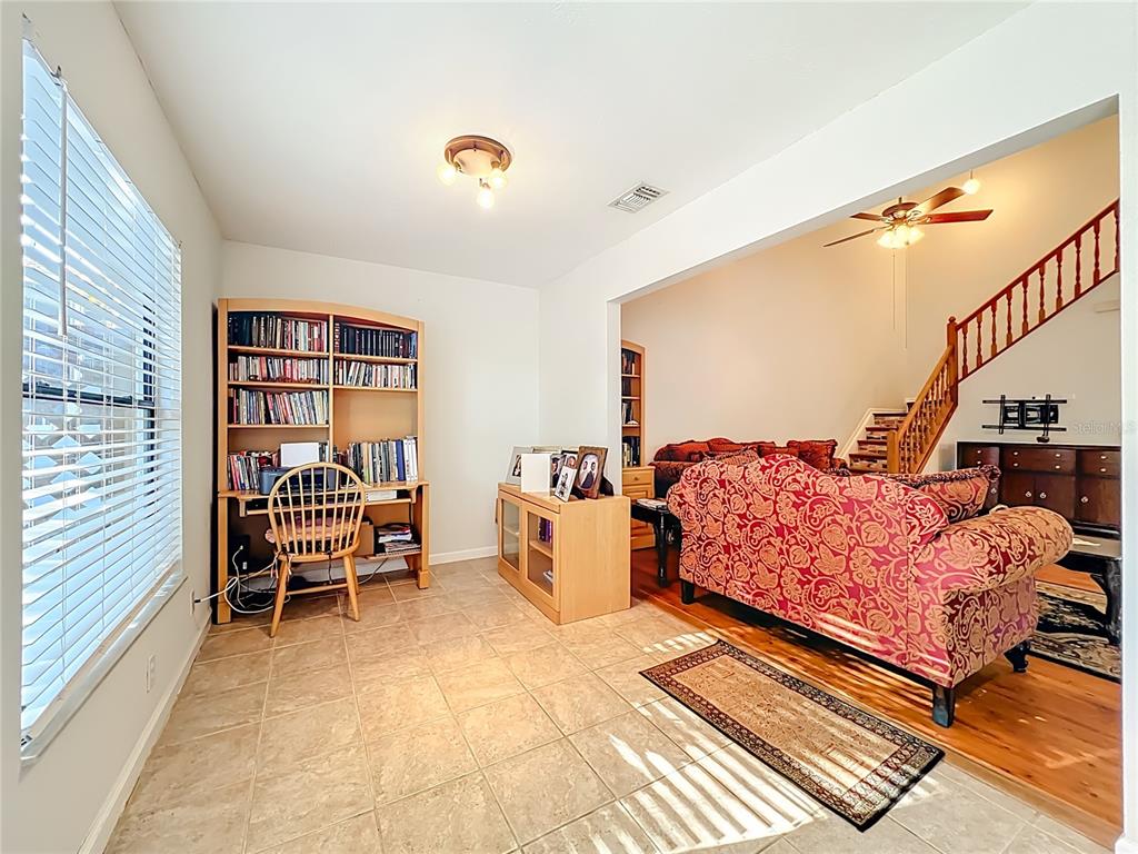 709 Lighthouse Court Altamonte Springs, FL 32714 - Photo 20 of 51 a bedroom with furniture and a book shelf