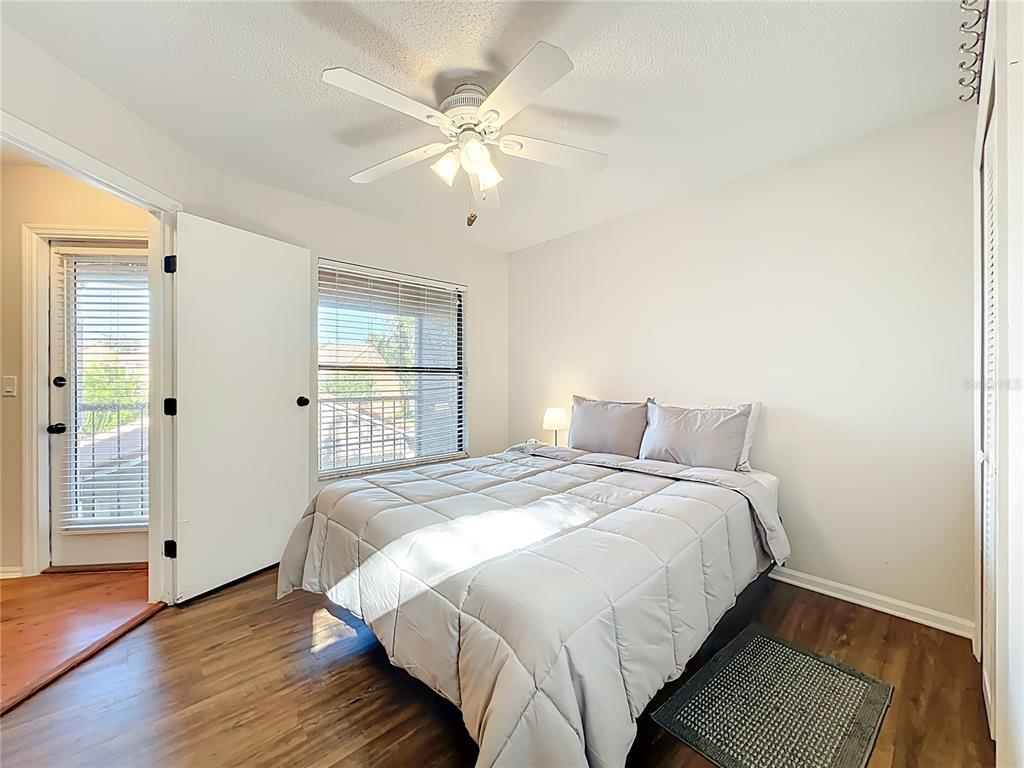 709 Lighthouse Court Altamonte Springs, FL 32714 - Photo 34 of 51 a bedroom with a large bed and a chandelier