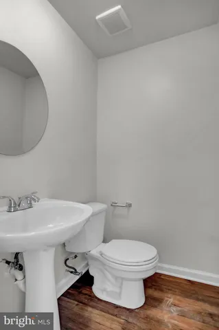 a view of an entryway with wooden floor