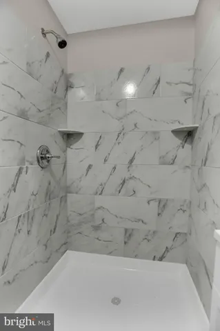 a bathroom with a toilet sink vanity and mirror