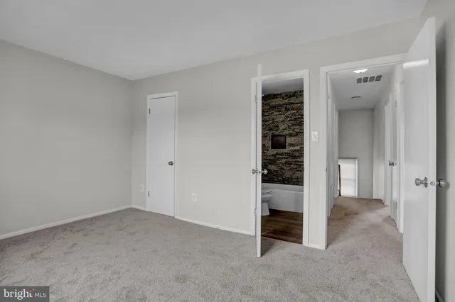 a bathroom with a sink a toilet and bathtub