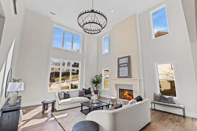 a kitchen that has a lot of cabinets in it and stainless steel appliances