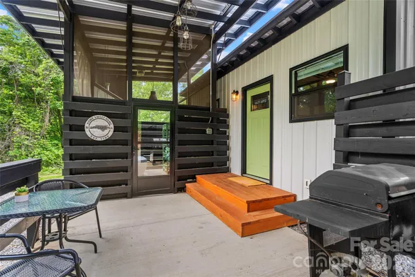 a bedroom with a bed a desk and chair